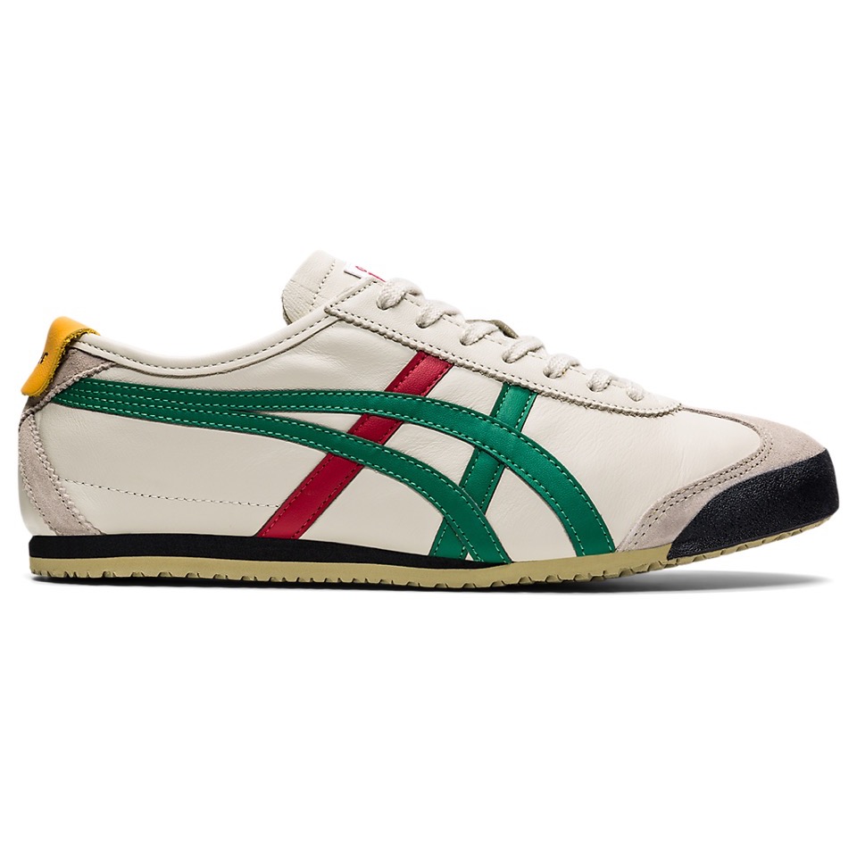 Right-facing Onitsuka Tiger Mexico 66 sneaker in birch with green stripes, red accents, a yellow heel tab, and a black toe bumper